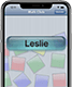 A thumbnail of an iPhone displaying a screen from RandoMeister where a student named Leslie has been picked.